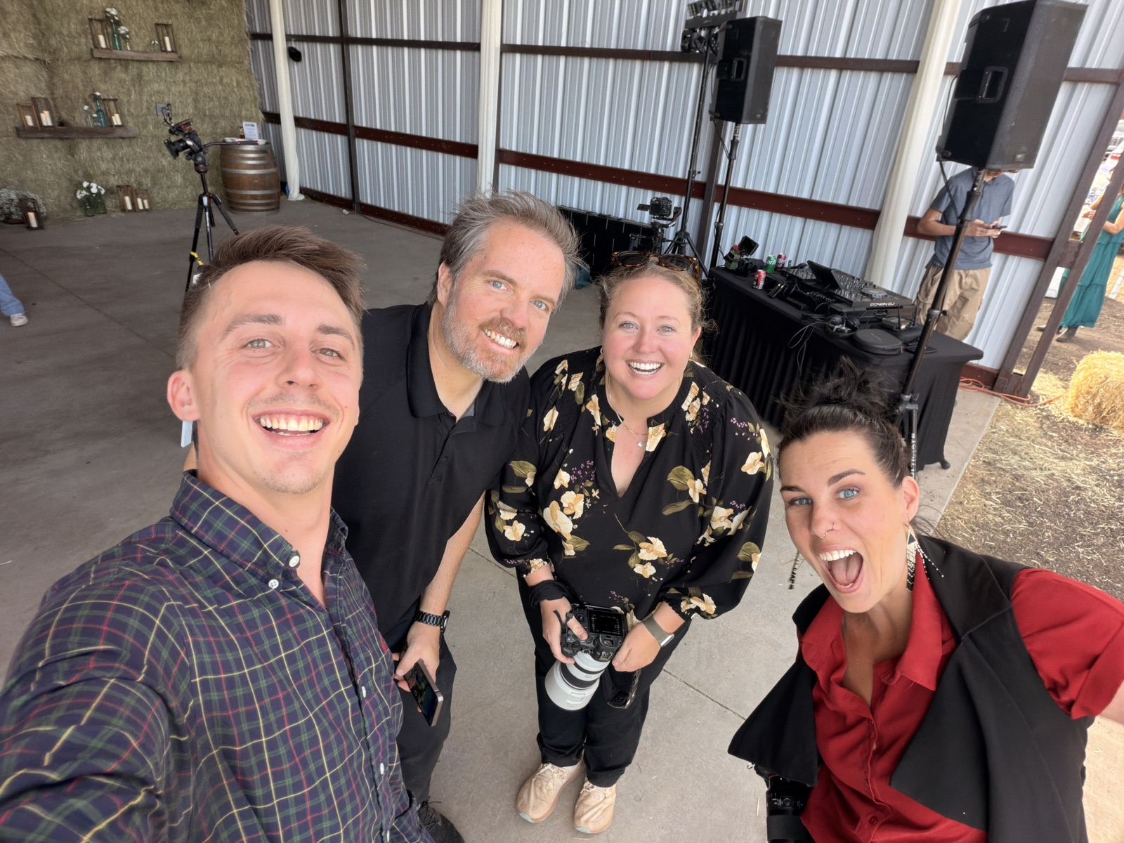Four Arizona Photo and Video team members together behind the scenes at a wedding venue