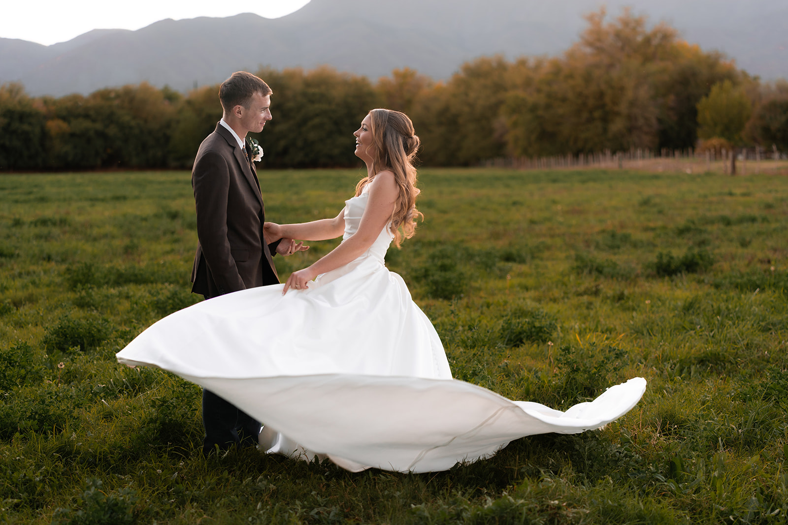 Bailey and Clay together in a sunlit mountain meadow