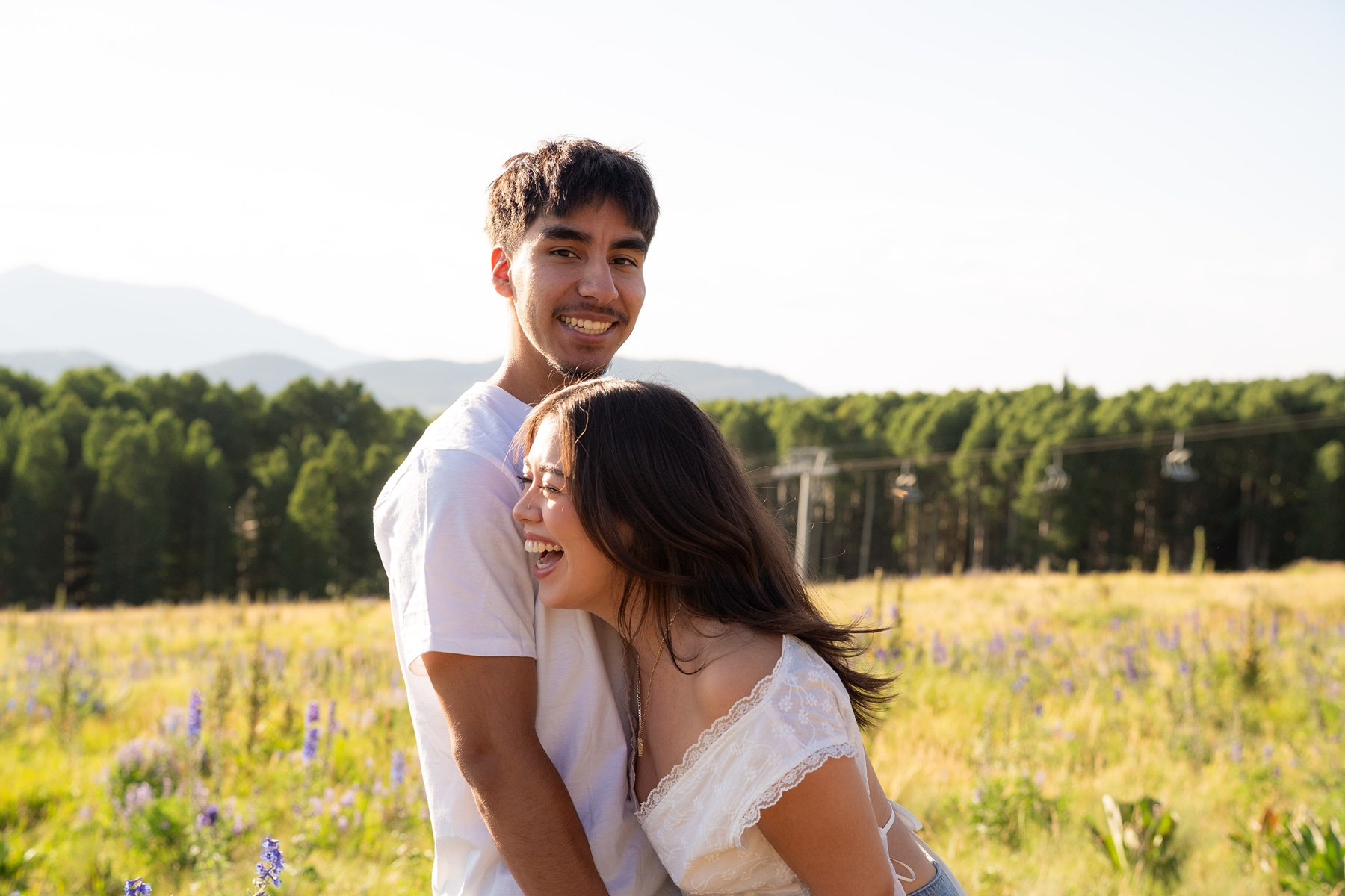 Emelia and Sean together in a sunlit Flagstaff meadow