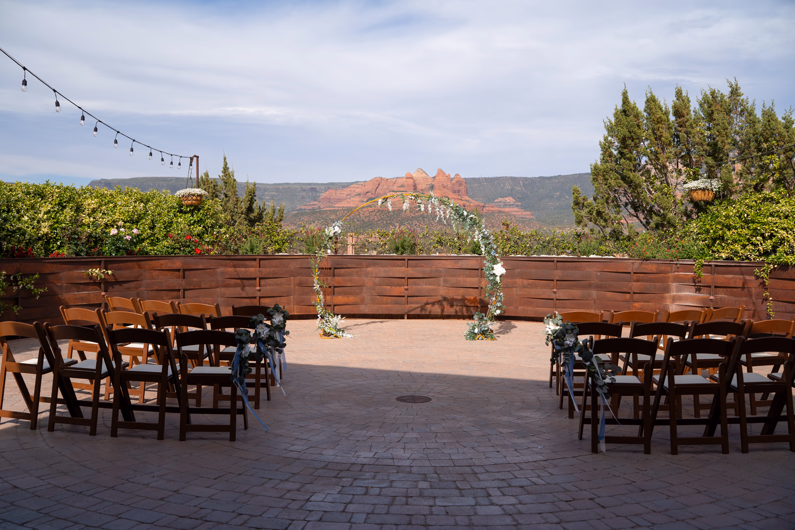 An outdoor wedding ceremony setting overlooking Sedona red rocks